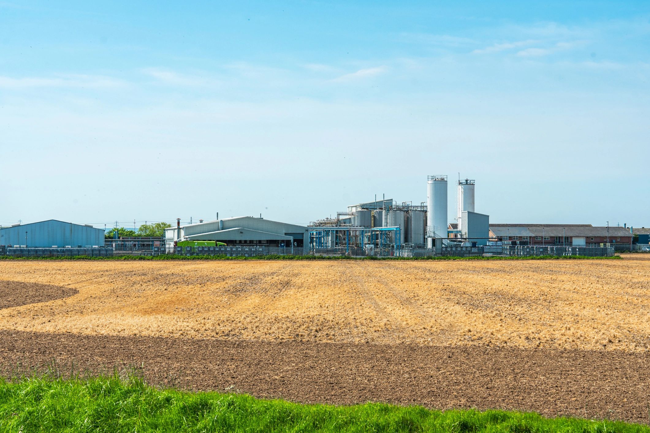 Industrial refinery landscape representing upstream market opportunities